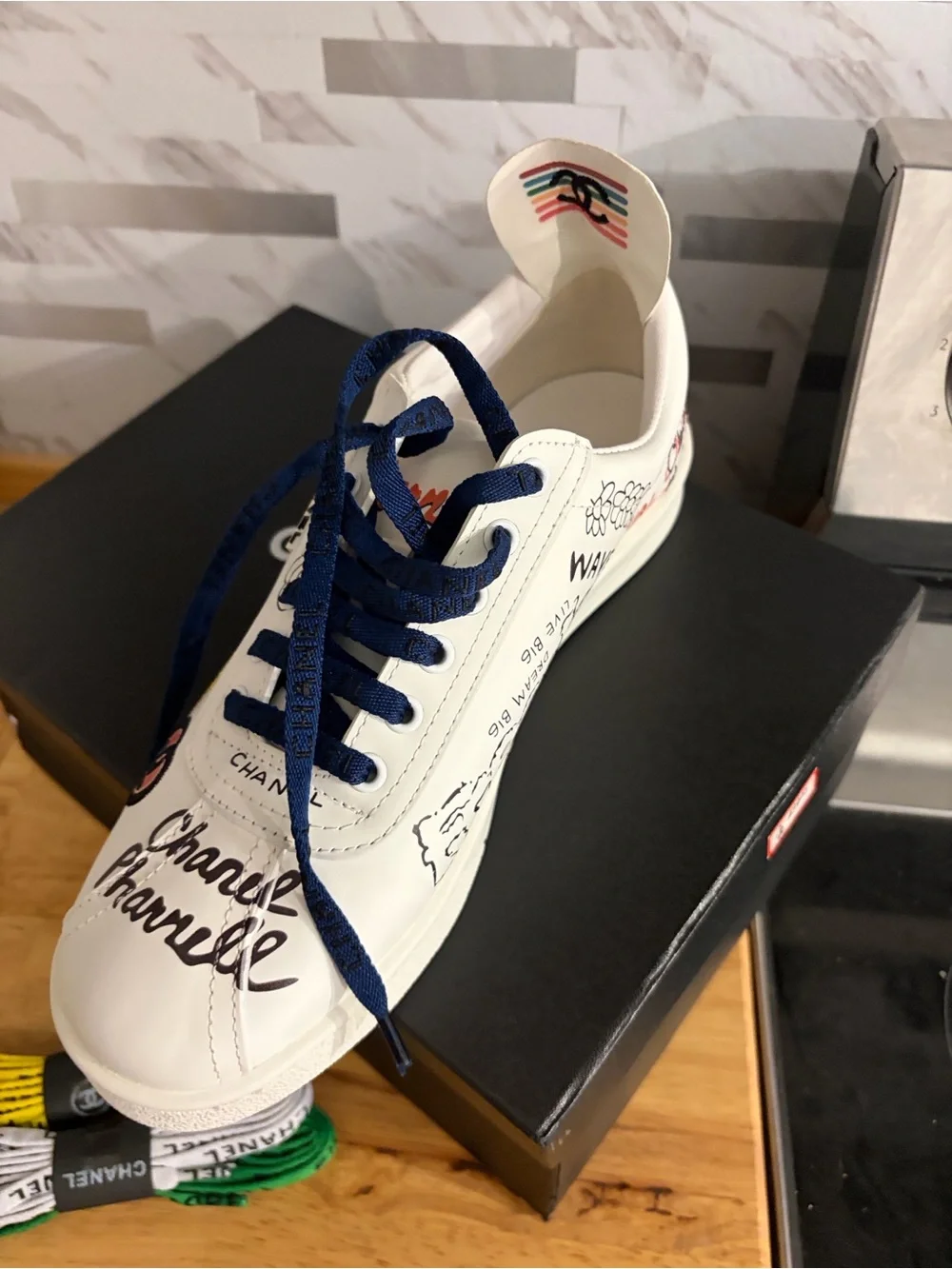 CHANEL White Kids Sneakers with Red and Navy Graphic Accents